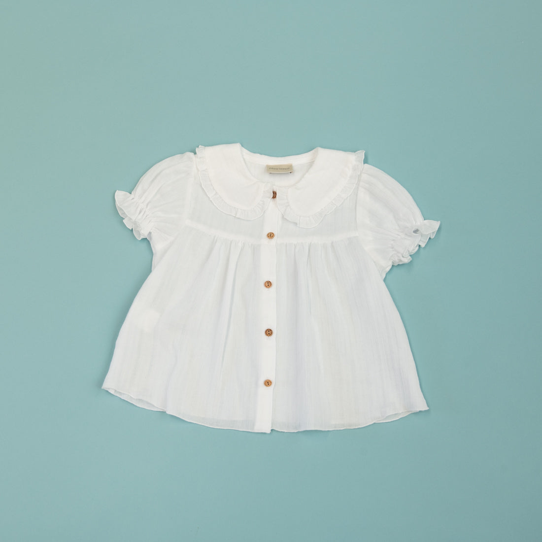BLUSA BLANCA BOTONES