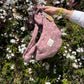 BANDOLERA MULTIPOSICIÓN MALVA